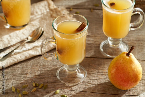 Hot pear drink with fresh yellow pears and cardamom