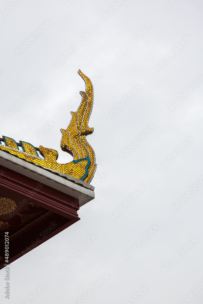 Fototapeta premium Thai traditional statue on the roof of Temple