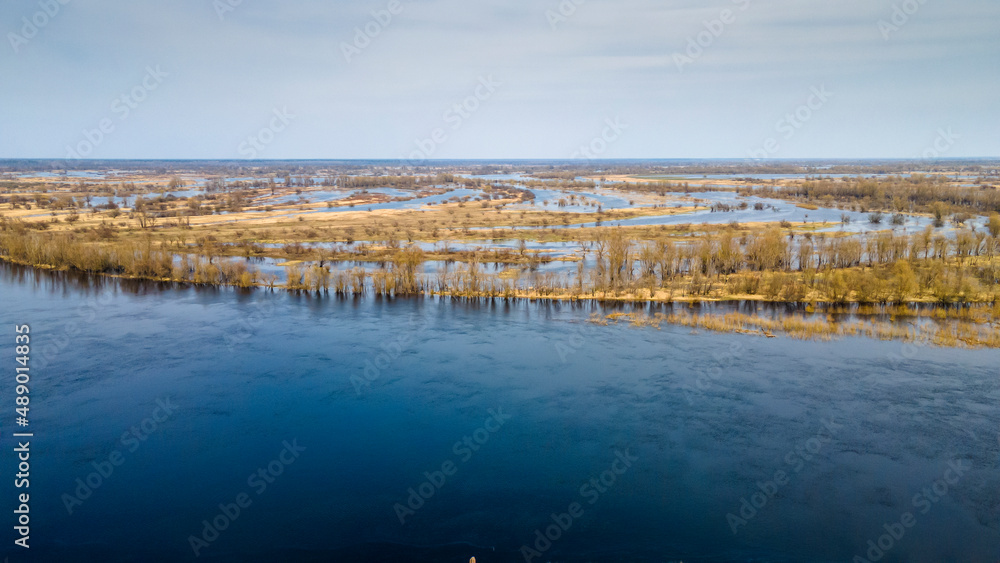 Aerial view flooded forest and fields. The high waters flooded a big area of farm land.