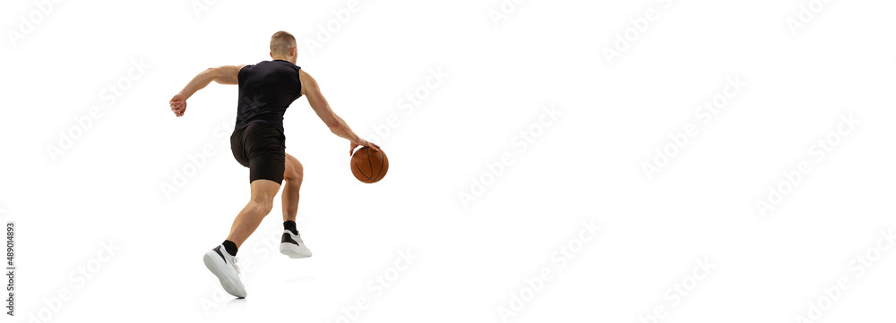 Flyer with young muscled man, basketball player running with ball isolated on white studio background. Sport, motion, activity concepts.