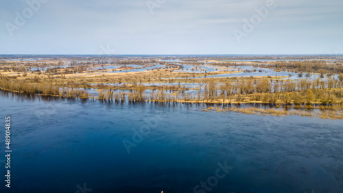 Aerial view flooded forest and fields. The high waters flooded a big area of farm land.