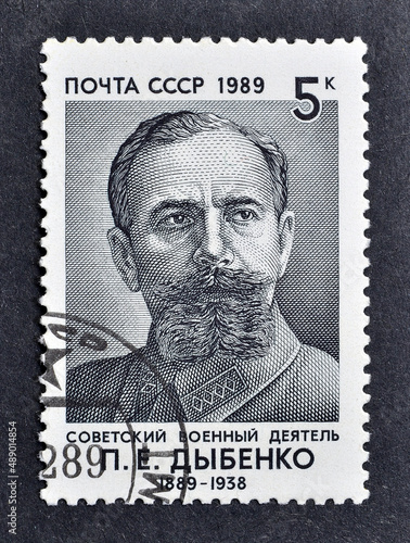 Cancelled postage stamp printed by Soviet Union, that shows portrait of P.E. Dybenko (1889-1938), Birth Centenary, circa 1989. photo