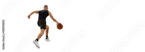 Flyer with young muscled man, basketball player running with ball isolated on white studio background. Sport, motion, activity concepts.