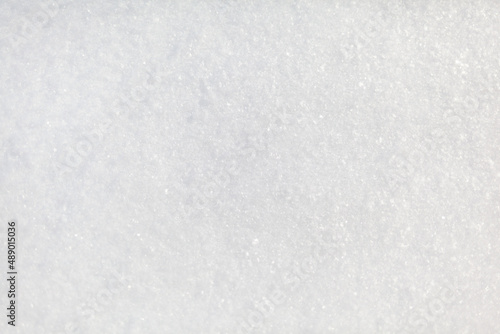 Clean, white snow close-up. Winter background. Snow surface. Fresh fluffy white snow texture.White snowflakes. High quality photo