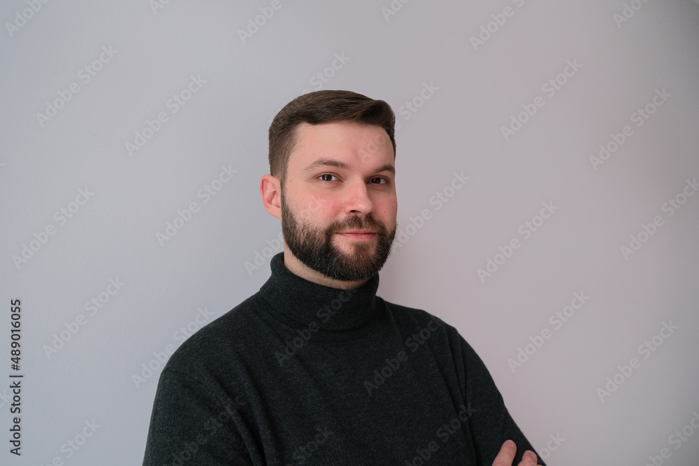 Fototapeta premium lifestyle portrait of a man in black on monochrome background
