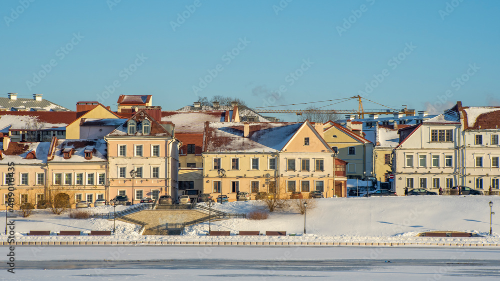 Obraz premium Panoramic view of old building in historical center of Minsk. Historical building near the frozen river.