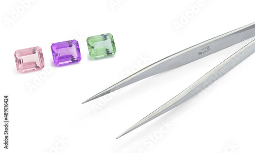 Pink, Purple and Green Amethyst Gemstones on White Background photo
