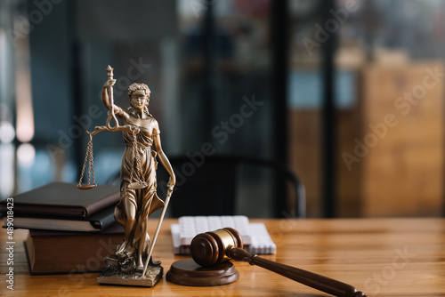 Obraz na plátně Statue of lady justice on desk of a judge or lawyer.