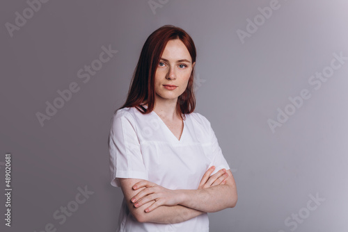 Medicine personal in uniform. Young woman doctor in clinic. Health care concept