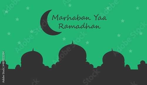 Greeting of marhaban ya ramadhan with lettering. Eid mubarak, green background and silhouette mosque template. (English: Welcome Ramadan)