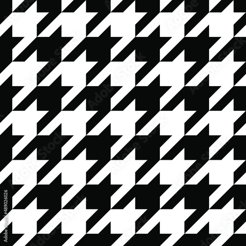 Seamless black and white checkered hound tooth pattern.
