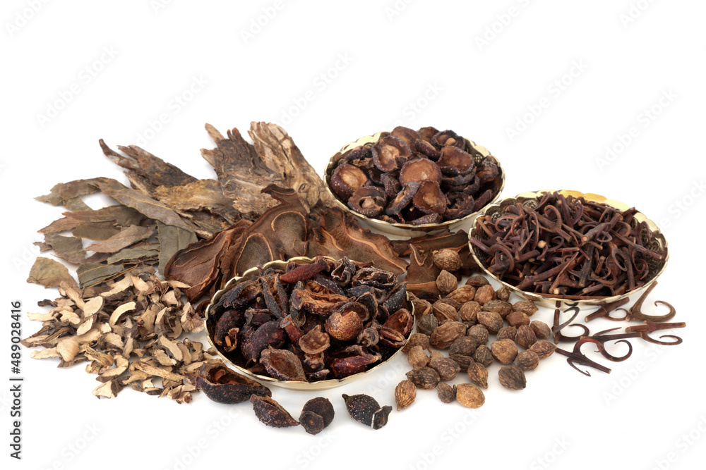 Chinese herbal medicine with herbs and spice used in ancient and traditional healing remedies. Natural plant medicine. On white background. Chinese herbal medicine with herbs and spice used in ancient and traditional healing remedies. Natural plant medicine. On white background.