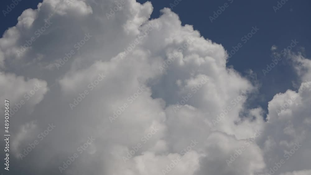 White clouds and blue sky time lapse, slow moving clouds. Puffy fluffy white clouds at summer day White clouds and blue sky time lapse, slow moving clouds. Puffy fluffy white clouds at summer day