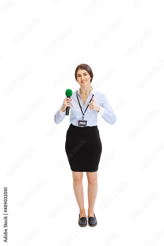 Young beautiful girl, female journalist holding reporter microphone isolated on white studio background. Concept of social media, press, news, information Young beautiful girl, female journalist holding reporter microphone isolated on white studio background. Concept of social media, press, news, information