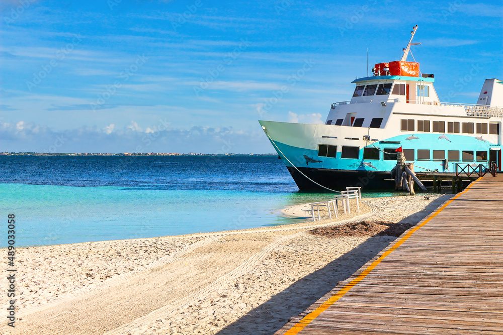 Playa Langosta pier, with a beautiful moored boat. Playa Langosta pier, with a beautiful moored boat.