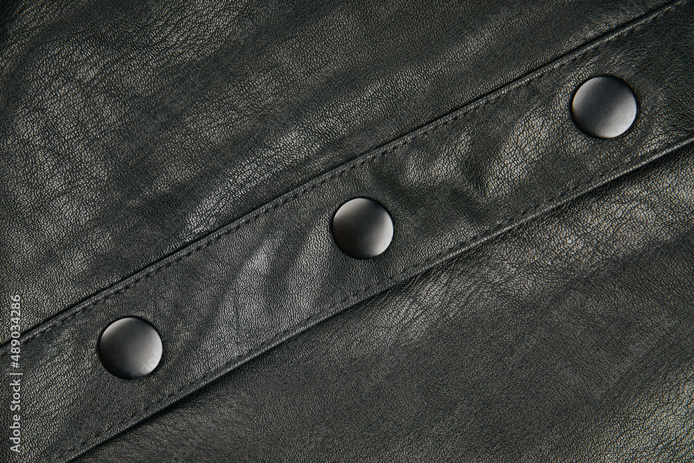 Black leather fabric textile material texture pattern macro blur background. Black leather fabric textile material texture pattern macro blur background.