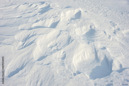Coarse texture of the snow, accented by a sliding sun light