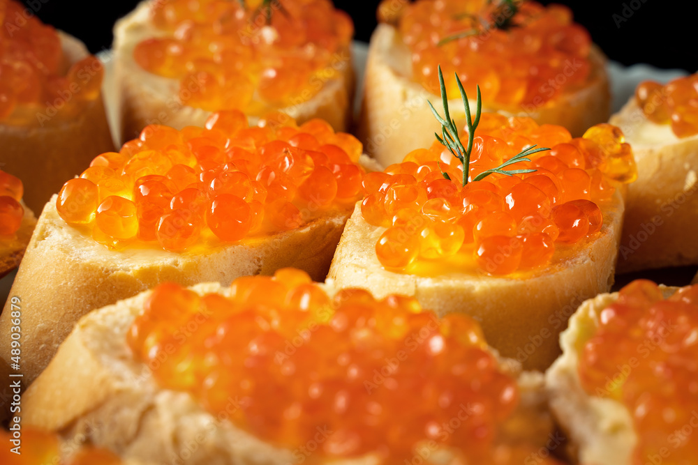 slices of white bread with red caviar slices of white bread with red caviar