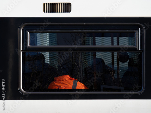 Commuter overland train detail, West London, with reflections of nature. photo