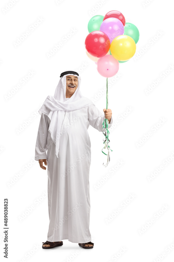 Full length portrait of a mature arab man holding balloons Full length portrait of a mature arab man holding balloons