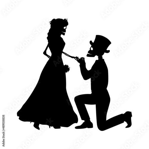 Silhouettes of male skeleton kneeling in front of female skeleton. Day of the dead.