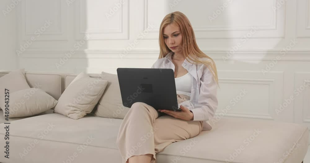 Woman working as a freelancer. Work remotely at home on a laptop. Woman working as a freelancer. Work remotely at home on a laptop.