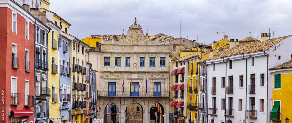 Panoramic view of the main square of Cuenca with its brightly colored houses, Spain.