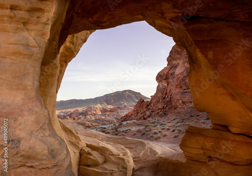 Valley of Fire State Park  Nevada  USA. View of valley of fire through stone arch 