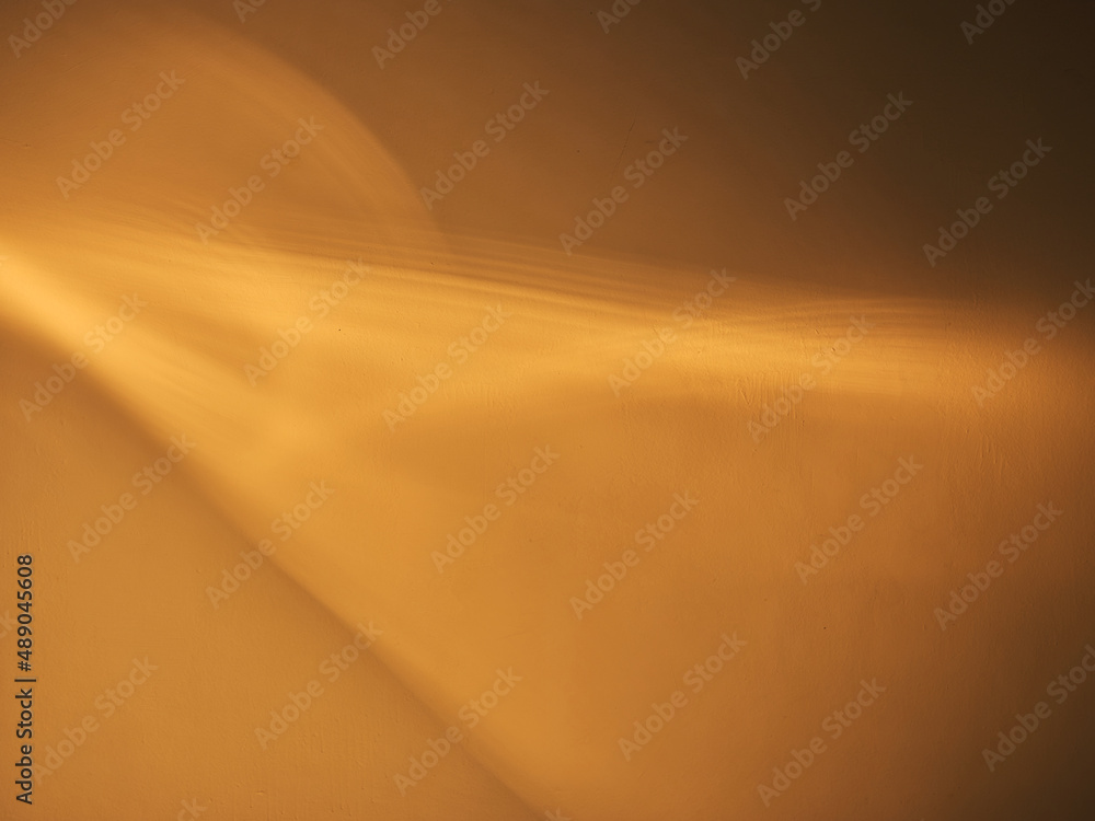 Fotografie Yellow abstract light texture on the wall