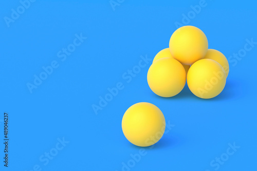 Heap of ping pong balls on blue background. Leisure games. International competitions. Sports Equipment. Table tennis. Copy space. 3d render