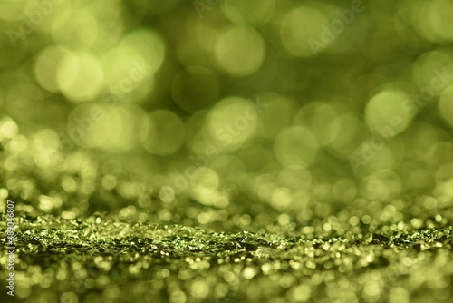 Green glitter lights texture. Abstract christmas background.
