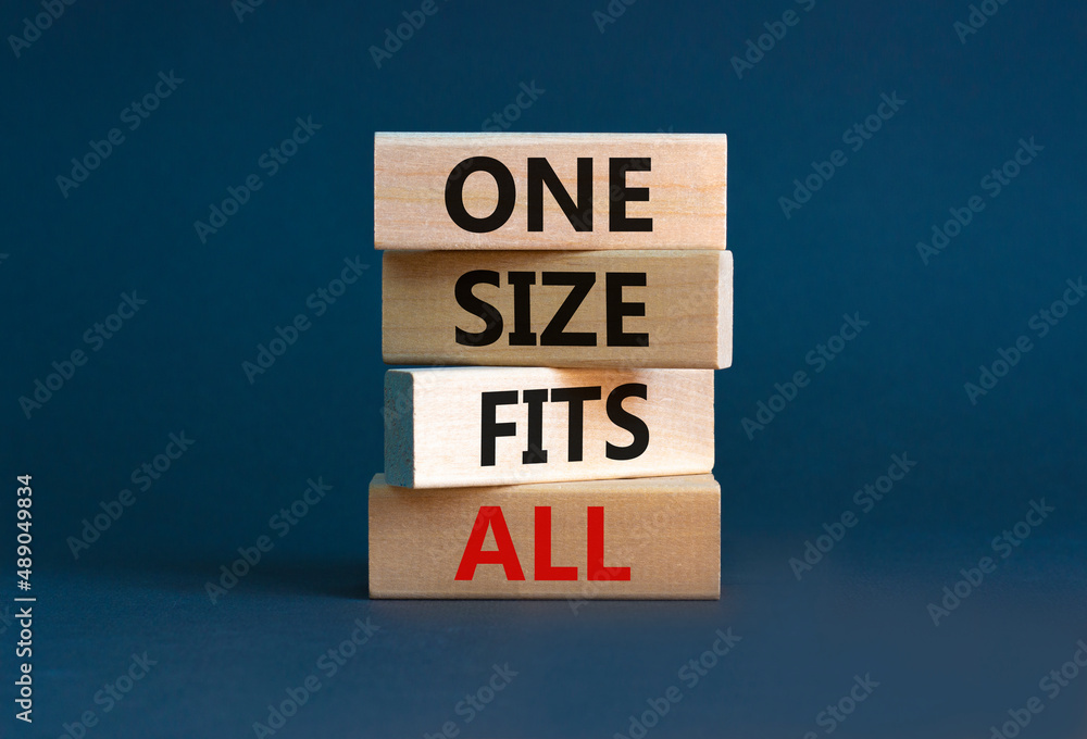 One size fits all symbol. Concept words One size fits all on wooden blocks. Beautiful grey table grey background. One size fits all business concept. Copy space. One size fits all symbol. Concept words One size fits all on wooden blocks. Beautiful grey table grey background. One size fits all business concept. Copy space.