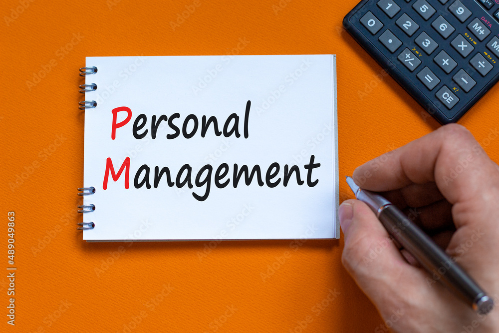 PM Personal management symbol. Concept words PM Personal management on white note. Businessman hand, calculator. Beautiful orange background. Business and PM personal management concept. PM Personal management symbol. Concept words PM Personal management on white note. Businessman hand, calculator. Beautiful orange background. Business and PM personal management concept.