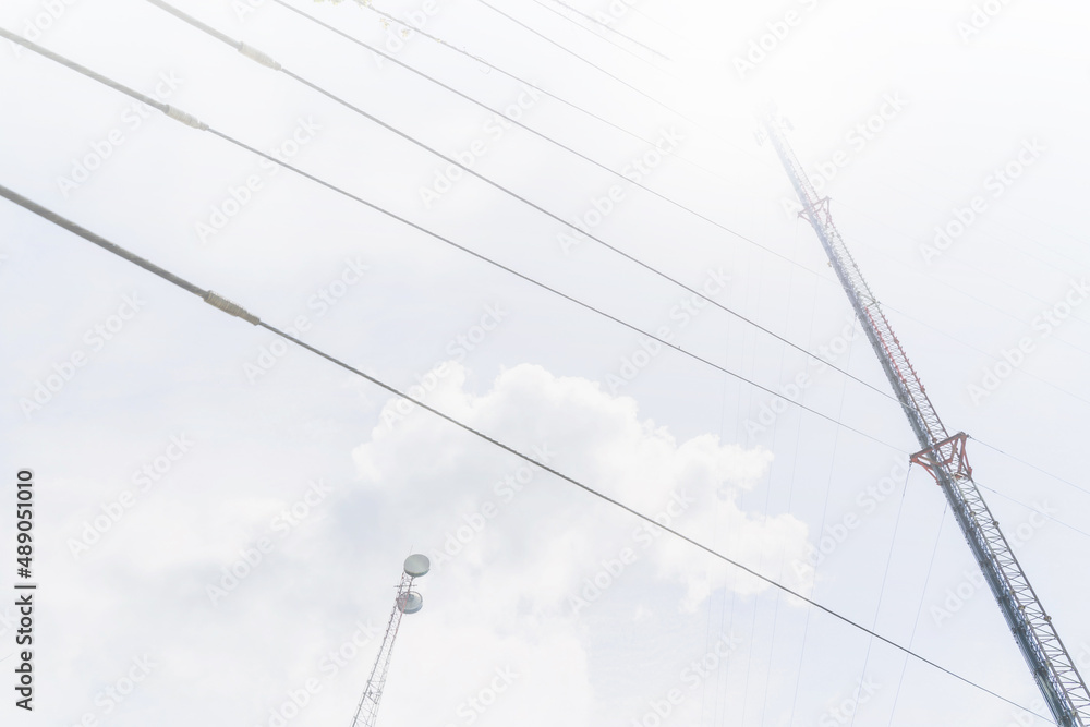 Telecommunication mast TV antennas in the afternoon ,on the hill blue sky with cloud bright at Phuket Thailand. Telecommunication mast TV antennas in the afternoon ,on the hill blue sky with cloud bright at Phuket Thailand.