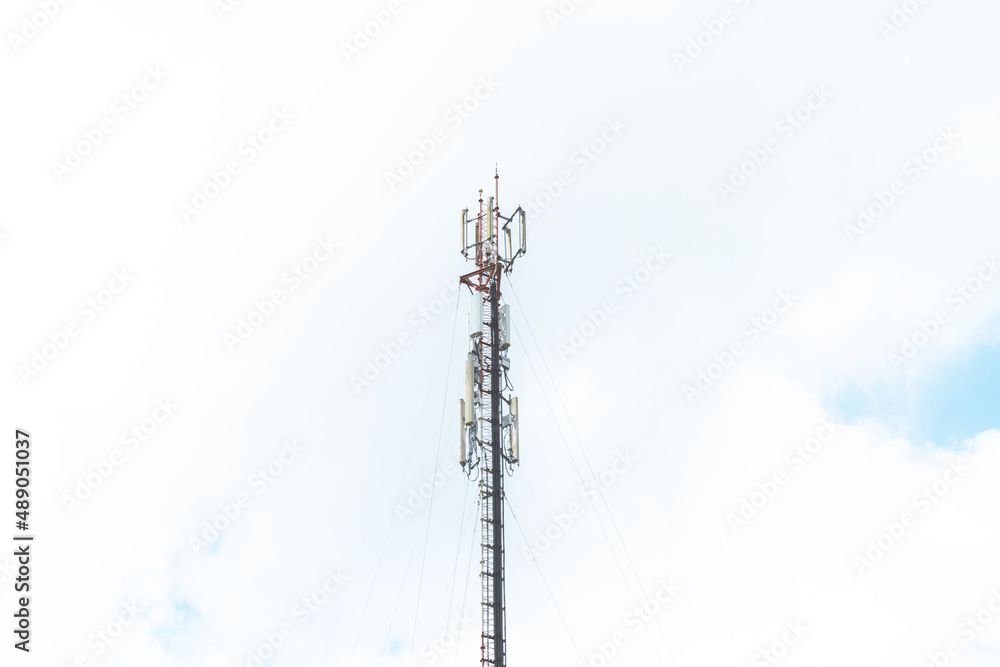 Telecommunication mast TV antennas in the afternoon ,on the hill blue sky with cloud bright at Phuket Thailand. Telecommunication mast TV antennas in the afternoon ,on the hill blue sky with cloud bright at Phuket Thailand.