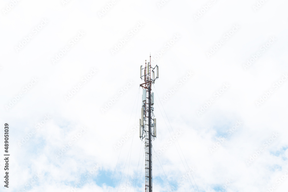 Telecommunication mast TV antennas in the afternoon ,on the hill blue sky with cloud bright at Phuket Thailand.