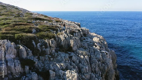 Aerial view of woman exploring landscape near Methoni, Greece photo