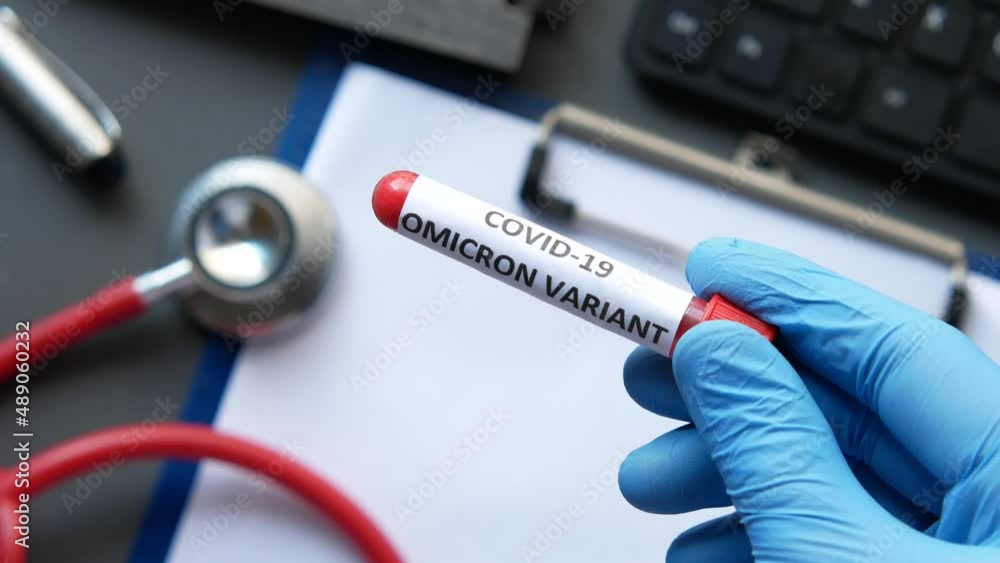  hand hold omicron variant corona virus blood test tube 