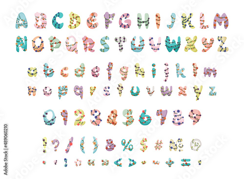 Collection of letters, numbers and punctuation marks with twining plants. Floral colorful font.