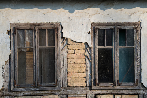 Sunja  Croatia  05 04 2021  Rustic style aged window in wooden village rural home wall.