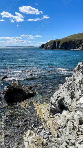 beautiful view of the bay, the blue water of the sea, rocks and the stone beach