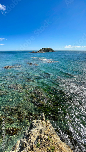 beautiful view of the bay, the blue water of the sea, rocks and the stone beach