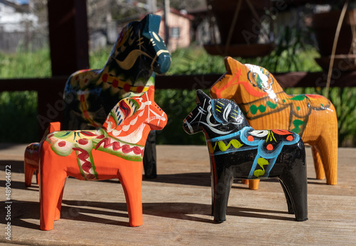 A group of Swedish wooden Dala horses in various colors © Diane N. Ennis