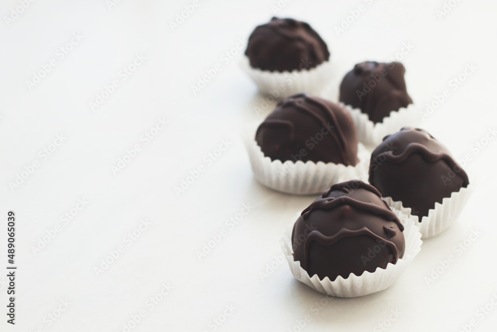Tasty chocolate bonbon sweets on light backround Tasty chocolate bonbon sweets on light backround