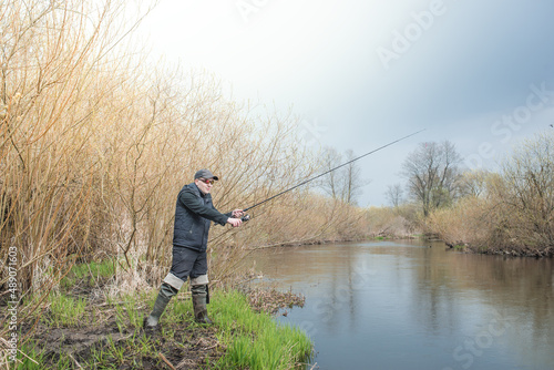 Fishing on the river bank.