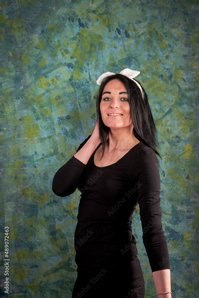 Fototapeta premium Brunette girl and black dress