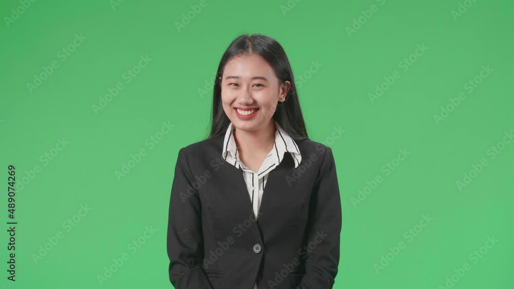 A Smiling Asian Business Woman Positively Shaking Her Head At The Camera In The Green Screen Studio
A Smiling Asian Business Woman Positively Shaking Her Head At The Camera In The Green Screen Studio