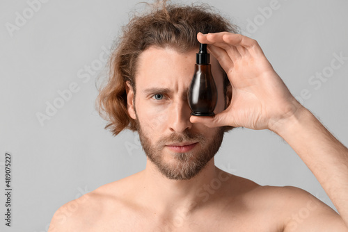 Young man with serum for sk...