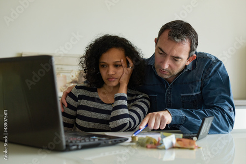 interracial couple managing consumer bills