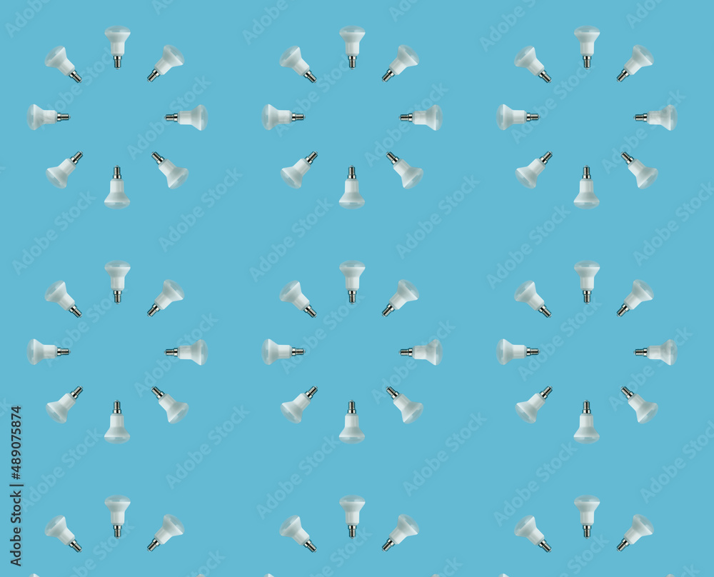 Fototapeta premium energy saving concept. seamless circle pattern of led lamps on a blue background.